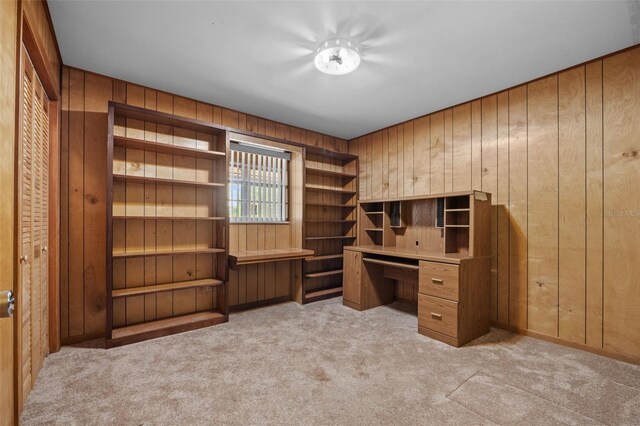 3441 Sherertz Rd, Lakeland, FL 33810 - unfurnished office featuring wood walls, light colored carpet, and built in desk