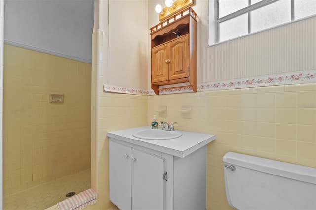 3441 Sherertz Rd, Lakeland, FL 33810 - full bathroom featuring toilet, tile walls, a stall shower, vanity, and wainscoting