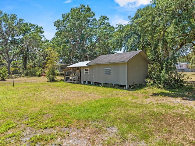 3441 Sherertz Rd, Lakeland, FL 33810 - back of house with a yard and a deck