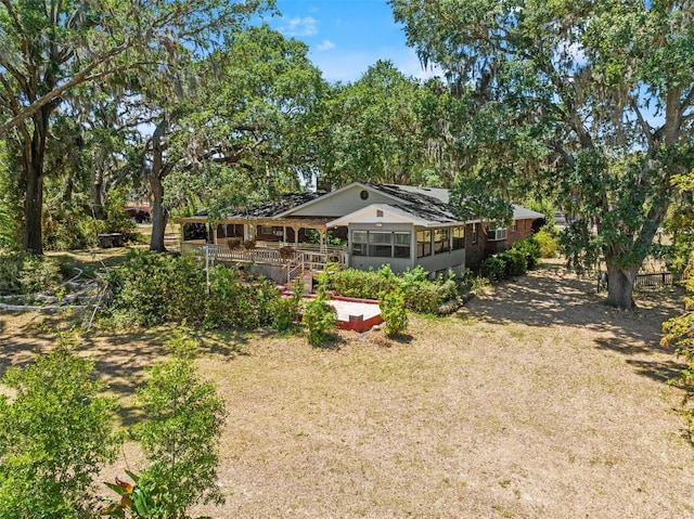 3441 Sherertz Rd, Lakeland, FL 33810 - view of green lawn featuring a wooden deck