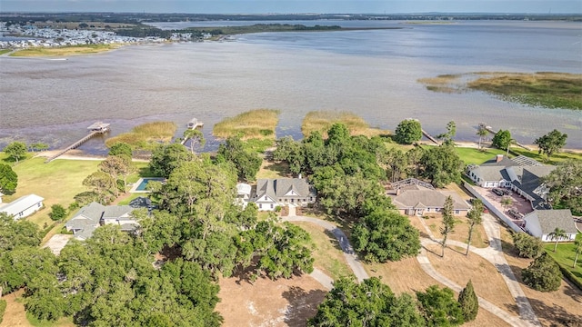 birds eye view of property featuring a water view and a residential view