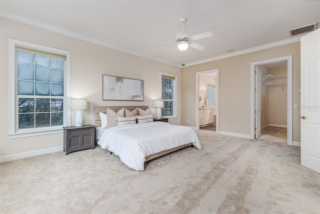 bedroom with baseboards, ornamental molding, light colored carpet, and visible vents