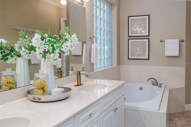 bathroom featuring a sink, a bath, and double vanity
