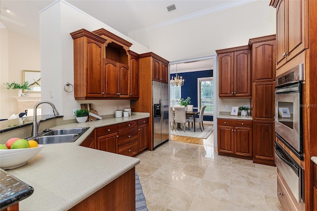 kitchen featuring visible vents, a chandelier, a sink, appliances with stainless steel finishes, and a warming drawer