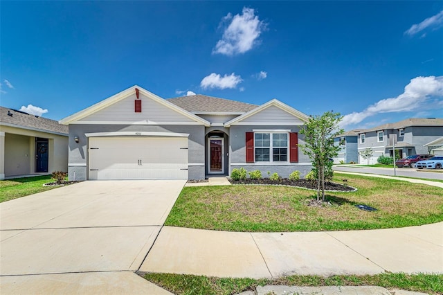 ranch-style house featuring an attached garage, concrete driveway, stucco siding, and a front lawn