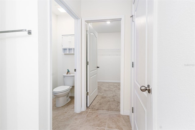 bathroom with tile patterned floors and toilet