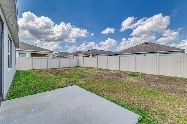 view of yard featuring a patio area and fence