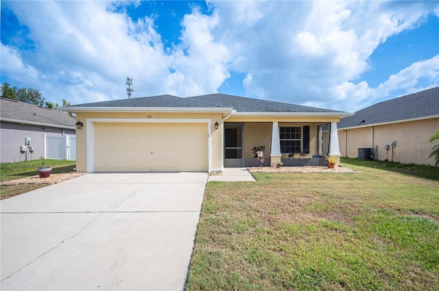 ranch-style home with central AC, a front yard, stucco siding, concrete driveway, and an attached garage