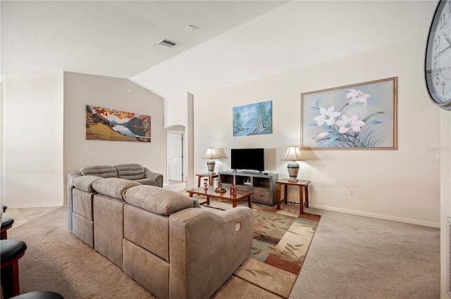 living room with arched walkways, light colored carpet, lofted ceiling, and visible vents