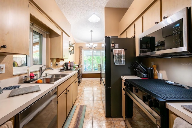 1061 Lowry Ave, Lakeland, FL 33801 - kitchen with a textured ceiling, stainless steel microwave, dishwashing machine, range with gas cooktop, and light countertops