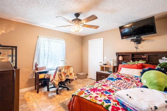 1061 Lowry Ave, Lakeland, FL 33801 - bedroom with a ceiling fan, baseboards, light tile patterned floors, and a textured ceiling