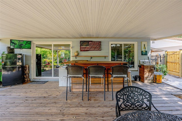 1061 Lowry Ave, Lakeland, FL 33801 - wooden deck featuring fence and outdoor dry bar