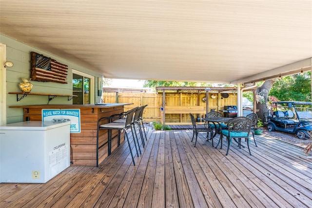 1061 Lowry Ave, Lakeland, FL 33801 - wooden deck featuring outdoor dry bar and fence