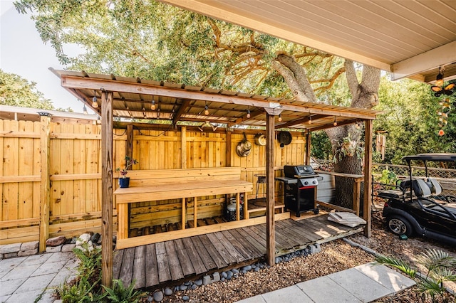 1061 Lowry Ave, Lakeland, FL 33801 - wooden deck with fence and area for grilling