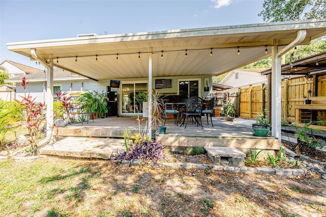 1061 Lowry Ave, Lakeland, FL 33801 - view of patio featuring a wooden deck and fence