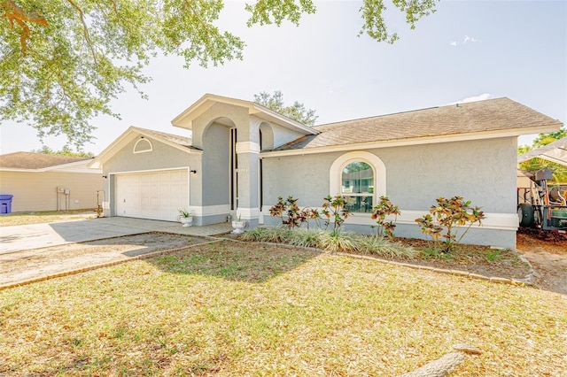 1061 Lowry Ave, Lakeland, FL 33801 - single story home with an attached garage, stucco siding, a front lawn, and driveway