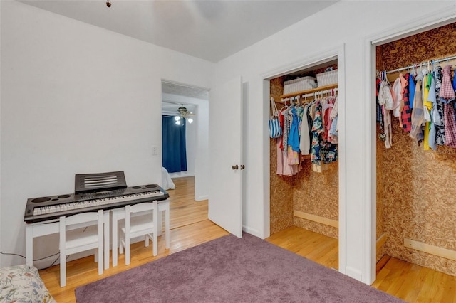 bedroom featuring baseboards and wood finished floors
