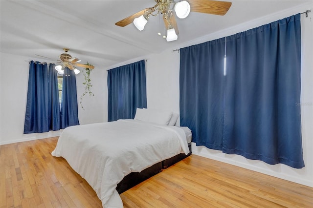 bedroom featuring ceiling fan and hardwood / wood-style floors