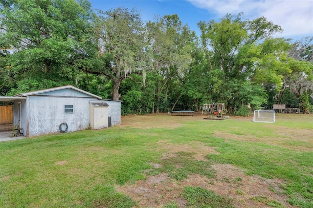 view of yard with a trampoline