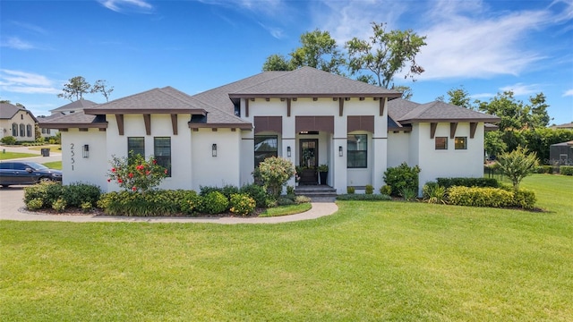 2551 Delphi Woods Cir, Lakeland, FL 33812 - view of front of property featuring stucco siding, a front lawn, and a shingled roof