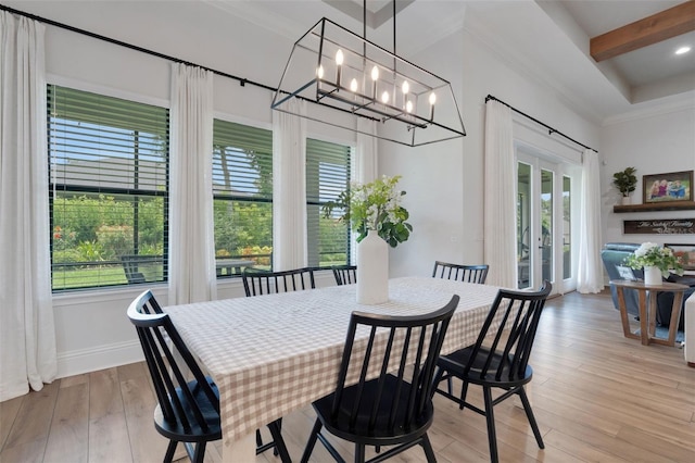 2551 Delphi Woods Cir, Lakeland, FL 33812 - dining area with a chandelier, light wood-style flooring, beam ceiling, baseboards, and ornamental molding