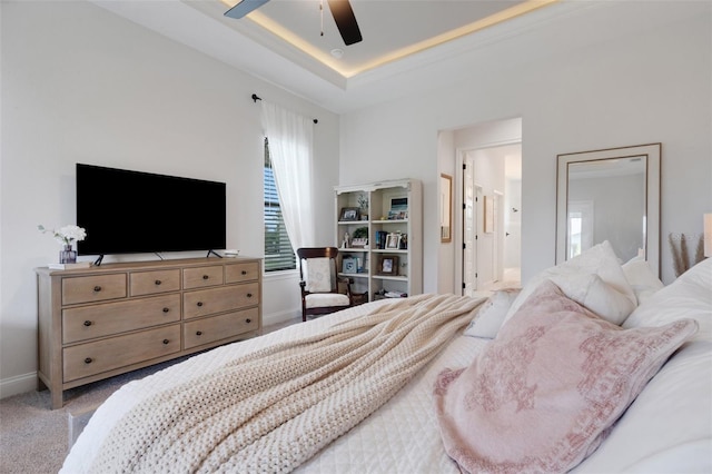 2551 Delphi Woods Cir, Lakeland, FL 33812 - bedroom featuring baseboards, carpet flooring, a raised ceiling, and ceiling fan