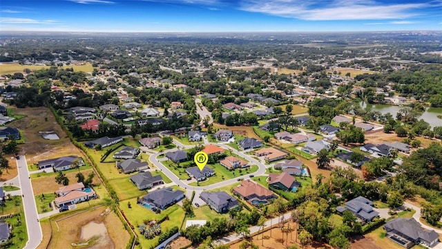 2551 Delphi Woods Cir, Lakeland, FL 33812 - aerial overview of property's location with nearby suburban area and a nearby body of water