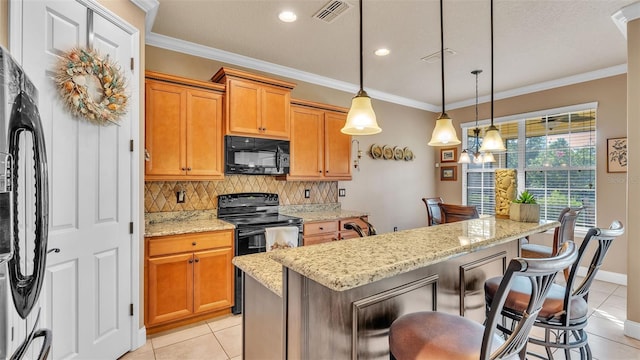 kitchen featuring black appliances, light tile patterned floors, backsplash, a kitchen breakfast bar, and light stone countertops
