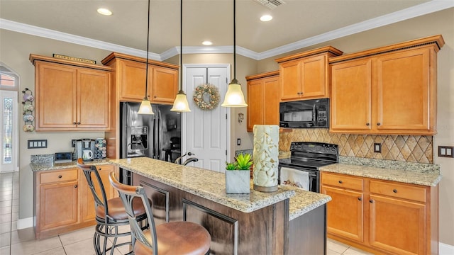 kitchen with black appliances, a center island, light tile patterned floors, decorative backsplash, and light stone counters