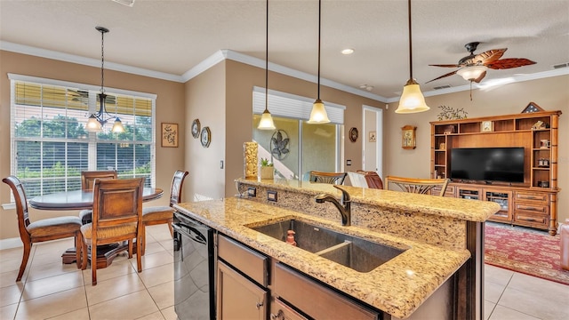 kitchen with dishwasher, a sink, light tile patterned floors, a ceiling fan, and pendant lighting