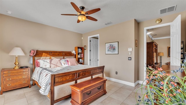 bedroom with light tile patterned floors, baseboards, and a ceiling fan