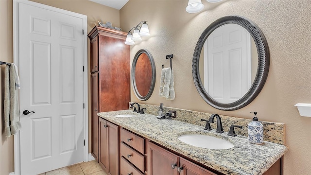 full bath with tile patterned flooring and double vanity