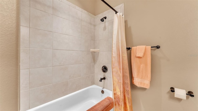 bathroom with shower / bath combination with curtain