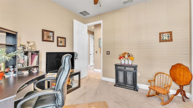 office space with a ceiling fan, baseboards, and carpet