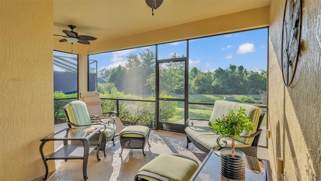sunroom featuring ceiling fan and outdoor lounge area