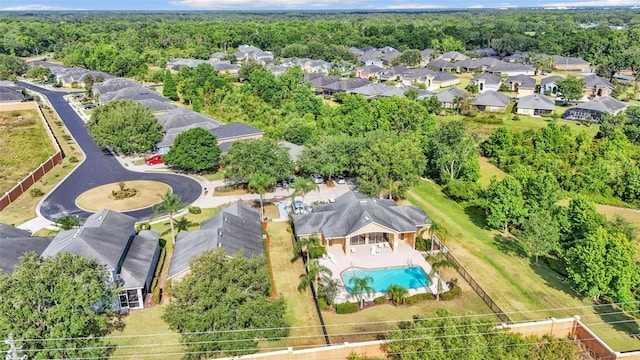 aerial perspective of suburban area featuring a pool