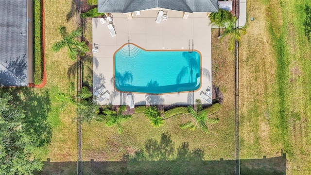 view of subject property with a pool