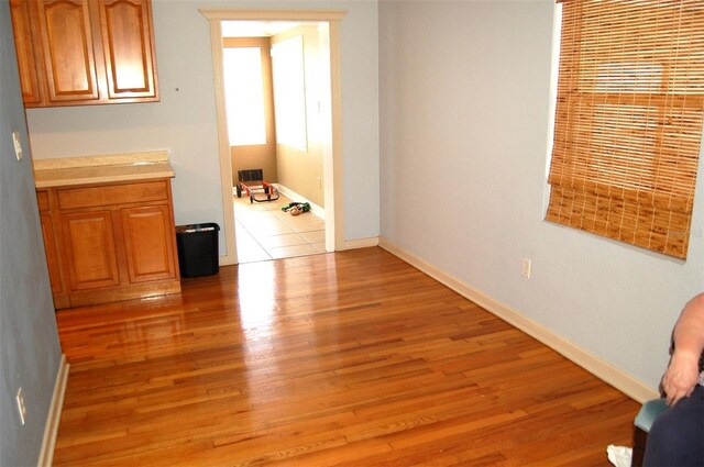 255 S Pennsylvania Ave, Lake Alfred, FL 33850 - spare room featuring light wood-style flooring and baseboards