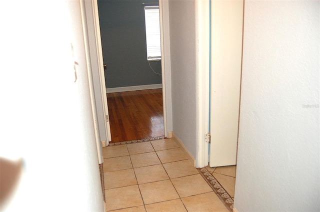 255 S Pennsylvania Ave, Lake Alfred, FL 33850 - hallway with light tile patterned floors and baseboards