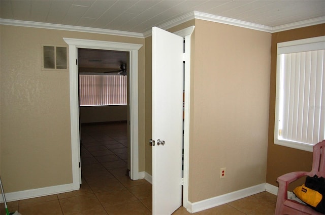 255 S Pennsylvania Ave, Lake Alfred, FL 33850 - corridor featuring crown molding, tile patterned flooring, and baseboards