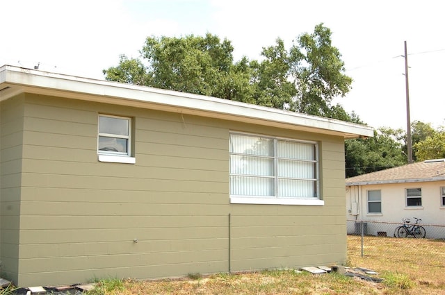 255 S Pennsylvania Ave, Lake Alfred, FL 33850 - view of side of home featuring fence