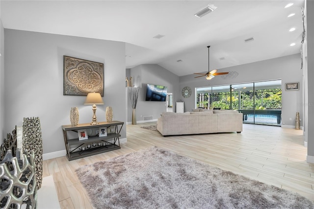 7313 Crape Myrtle Way, Sarasota, FL 34241 - living area with a ceiling fan, baseboards, vaulted ceiling, and wood finished floors
