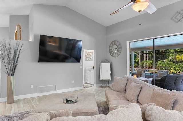 7313 Crape Myrtle Way, Sarasota, FL 34241 - living room with a ceiling fan, wood finished floors, high vaulted ceiling, and baseboards