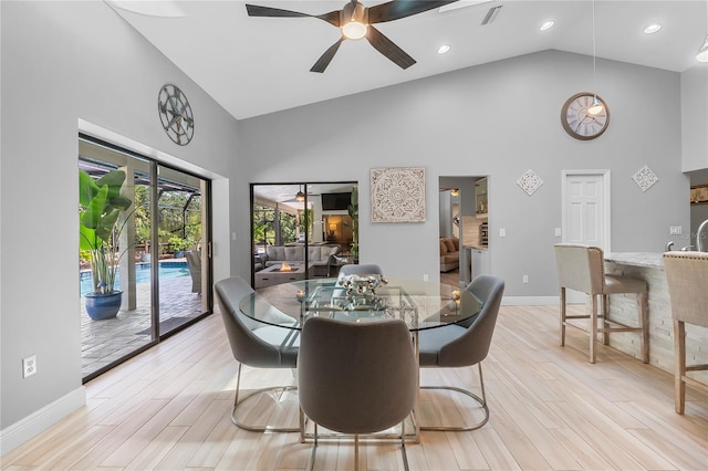 7313 Crape Myrtle Way, Sarasota, FL 34241 - dining room featuring high vaulted ceiling, baseboards, a ceiling fan, light wood finished floors, and recessed lighting