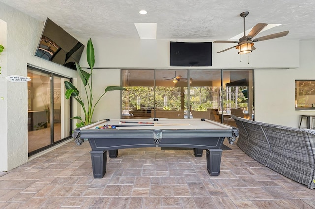 7313 Crape Myrtle Way, Sarasota, FL 34241 - playroom featuring a ceiling fan, pool table, a textured ceiling, and stone finish flooring