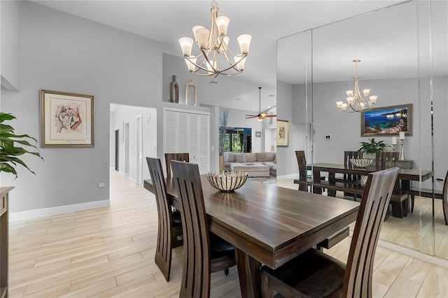 7313 Crape Myrtle Way, Sarasota, FL 34241 - dining area with a chandelier, baseboards, ceiling fan, light wood finished floors, and high vaulted ceiling