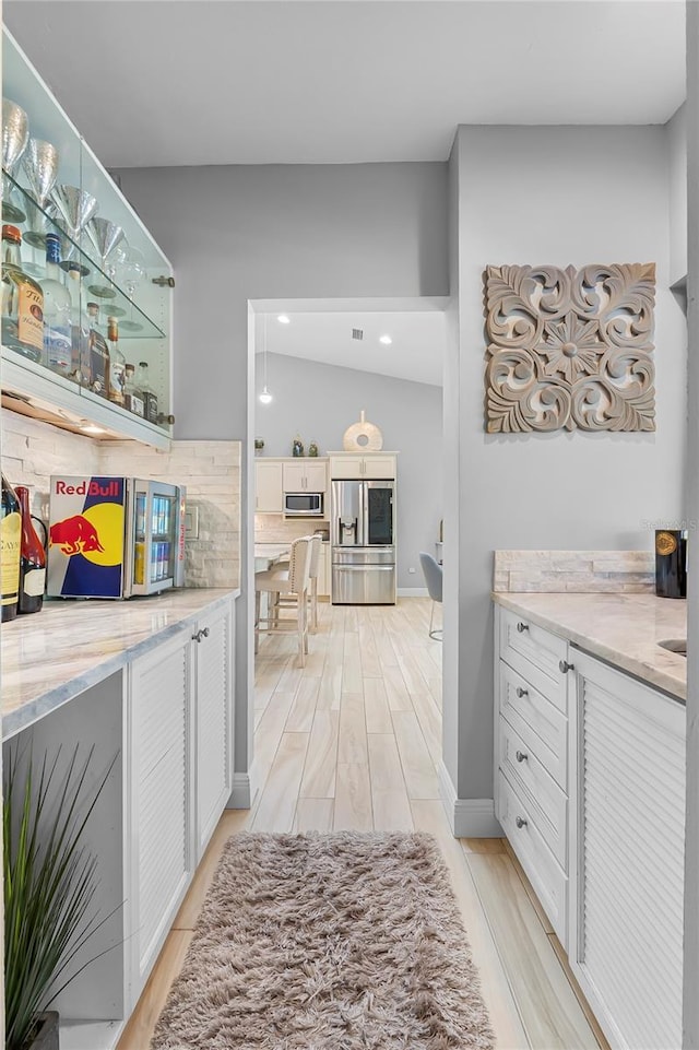 7313 Crape Myrtle Way, Sarasota, FL 34241 - hallway featuring light wood finished floors and recessed lighting