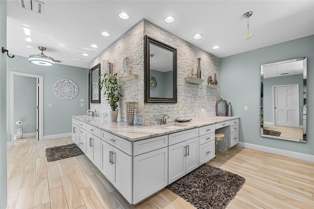 7313 Crape Myrtle Way, Sarasota, FL 34241 - full bathroom with baseboards, double vanity, recessed lighting, decorative backsplash, and wood finished floors