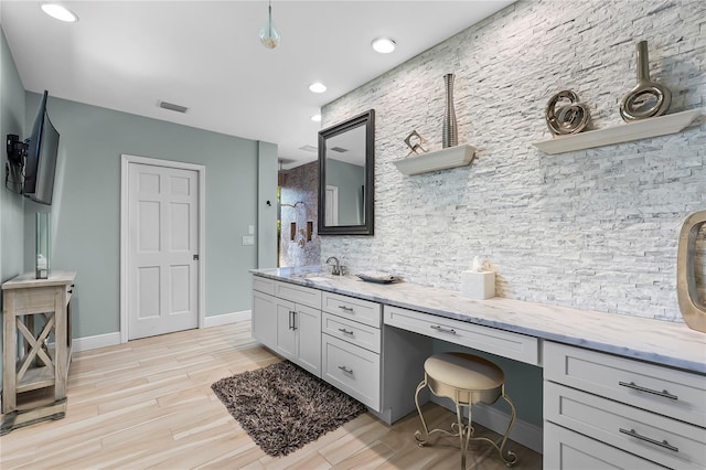 7313 Crape Myrtle Way, Sarasota, FL 34241 - full bathroom featuring wood finished floors, vanity, decorative backsplash, baseboards, and recessed lighting