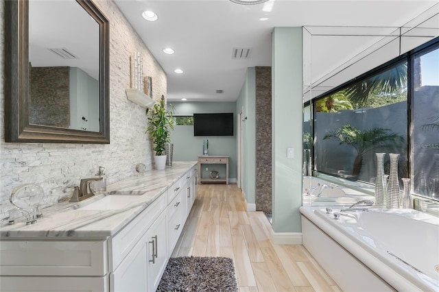 7313 Crape Myrtle Way, Sarasota, FL 34241 - full bathroom featuring vanity, a bath, baseboards, recessed lighting, and backsplash